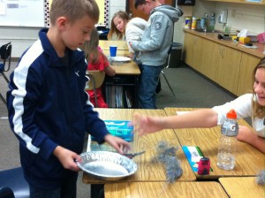 Fifth graders making Martian sand