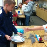 Fifth graders making Martian sand