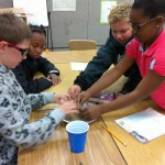 Fifth graders making Martian sand3